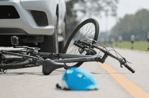 bike on ground in front of car