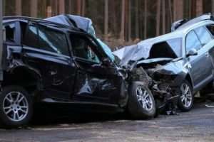 two badly crashed vehicles