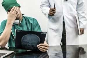 two doctors looking at scans