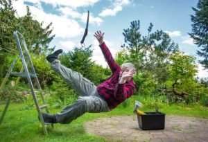 man slipping and falling off ladder
