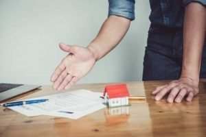 man frustrated pointing at paper