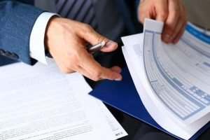 man looking through paperwork