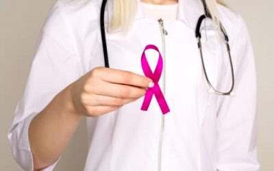 doctor holding up pink ribbon