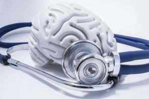 stethoscope around white brain