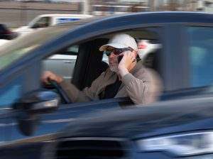 A speeding driver talks on his phone