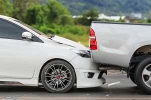 passenger car rear-ending a pick-up truck