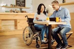 Team,Spirit.,Beautiful,Exuberant,Disabled,Woman,And,A,Handsome,Cheerful
