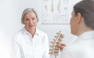 doctor going over a spinal issue with a patient