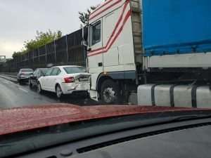 Truck hit passenger car in the rain
