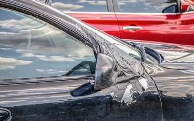 damaged rear-view mirror in a sideswipe accident