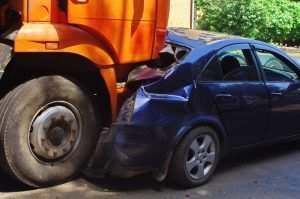 truck crushing a passenger car