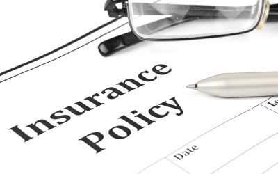 close-up on insurance policy and glasses