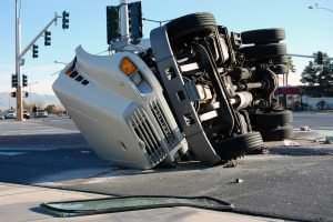 overturned truck in the road
