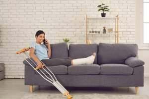 woman with a broken leg on the couch