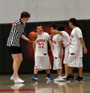 Daniel Gedeon, volunteering as a baseball coach.