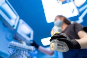 Doctor applying anesthesia during labor, which could lead to a birth injury claim if an error was made.